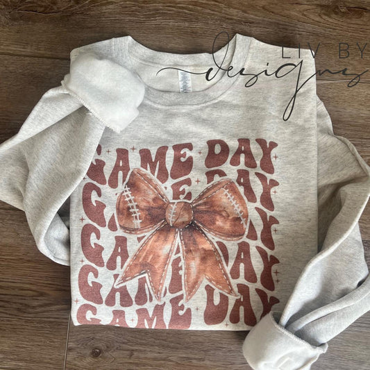Football game day bow sublimated design on Gildan grey crewneck sweatshirt