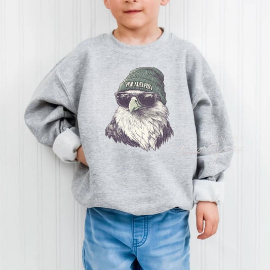 Youth wearing Philadelphia Eagle sublimated crewneck in ash gray