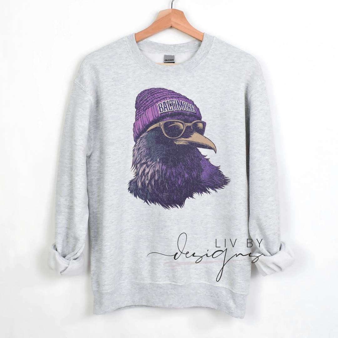Ash grey sports fan hoodie with sublimated raven design