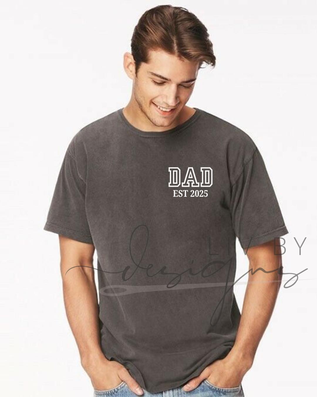 “Man wearing DAD EST 2022 shirt”