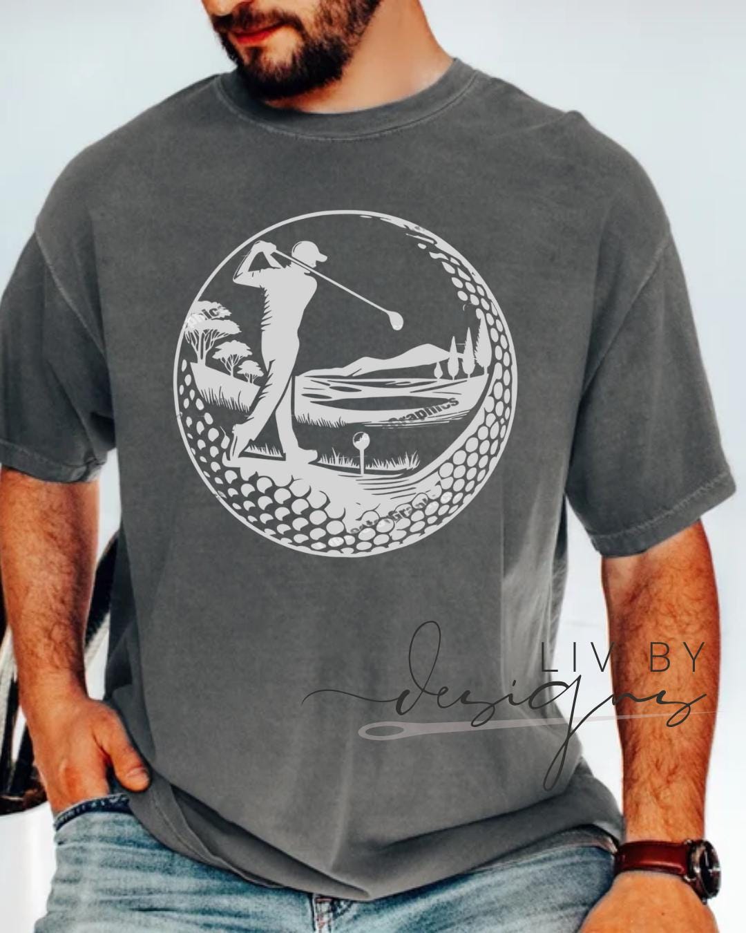 “Comfort Colors tee in Pepper with golf ball and golfer silhouette design”