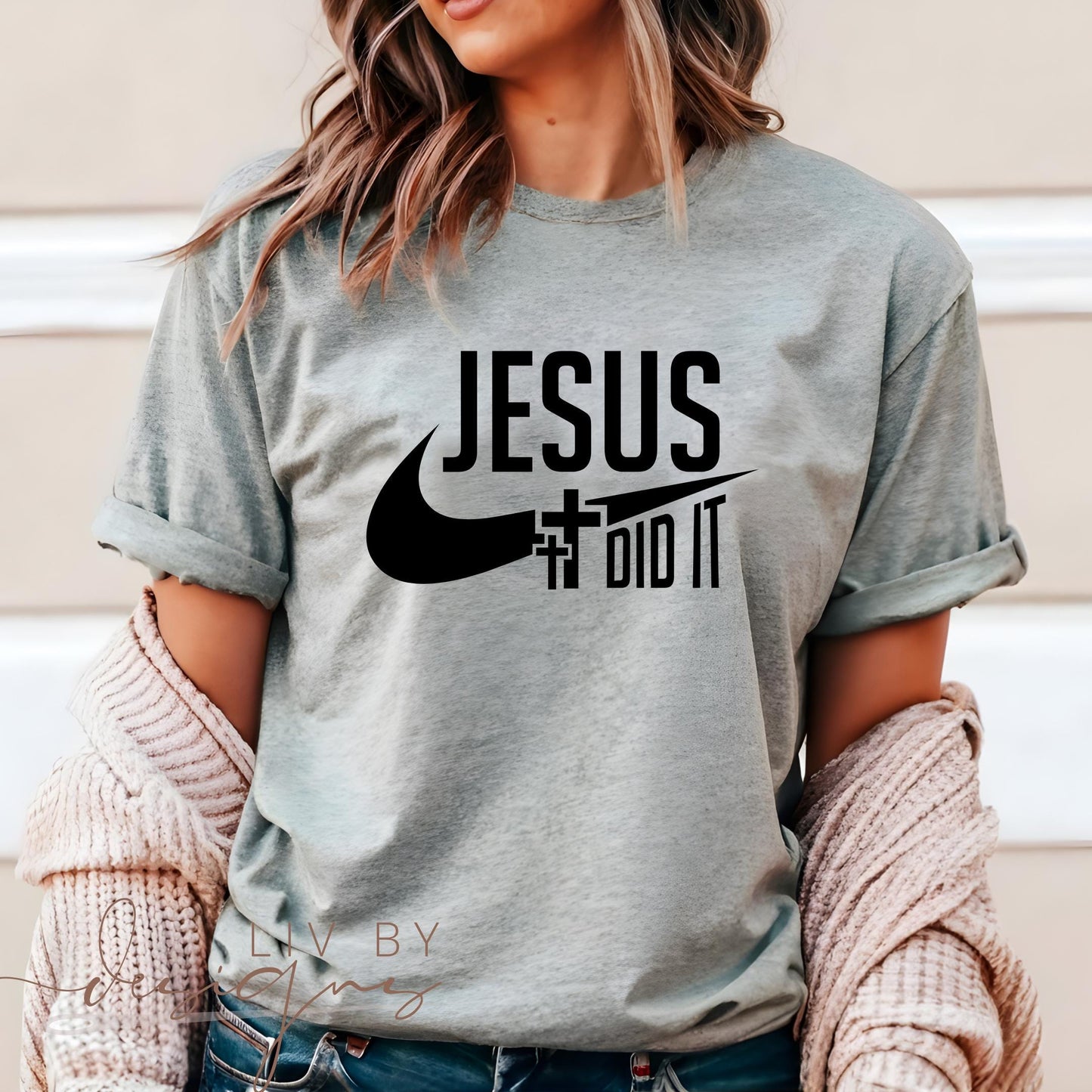 Woman wearing light grey “Jesus Did It” Comfort Colors T-shirt, styled with rolled sleeves and casual outfit, perfect for Christian fashion and religious gatherings. (etsy image id: 6261137911)