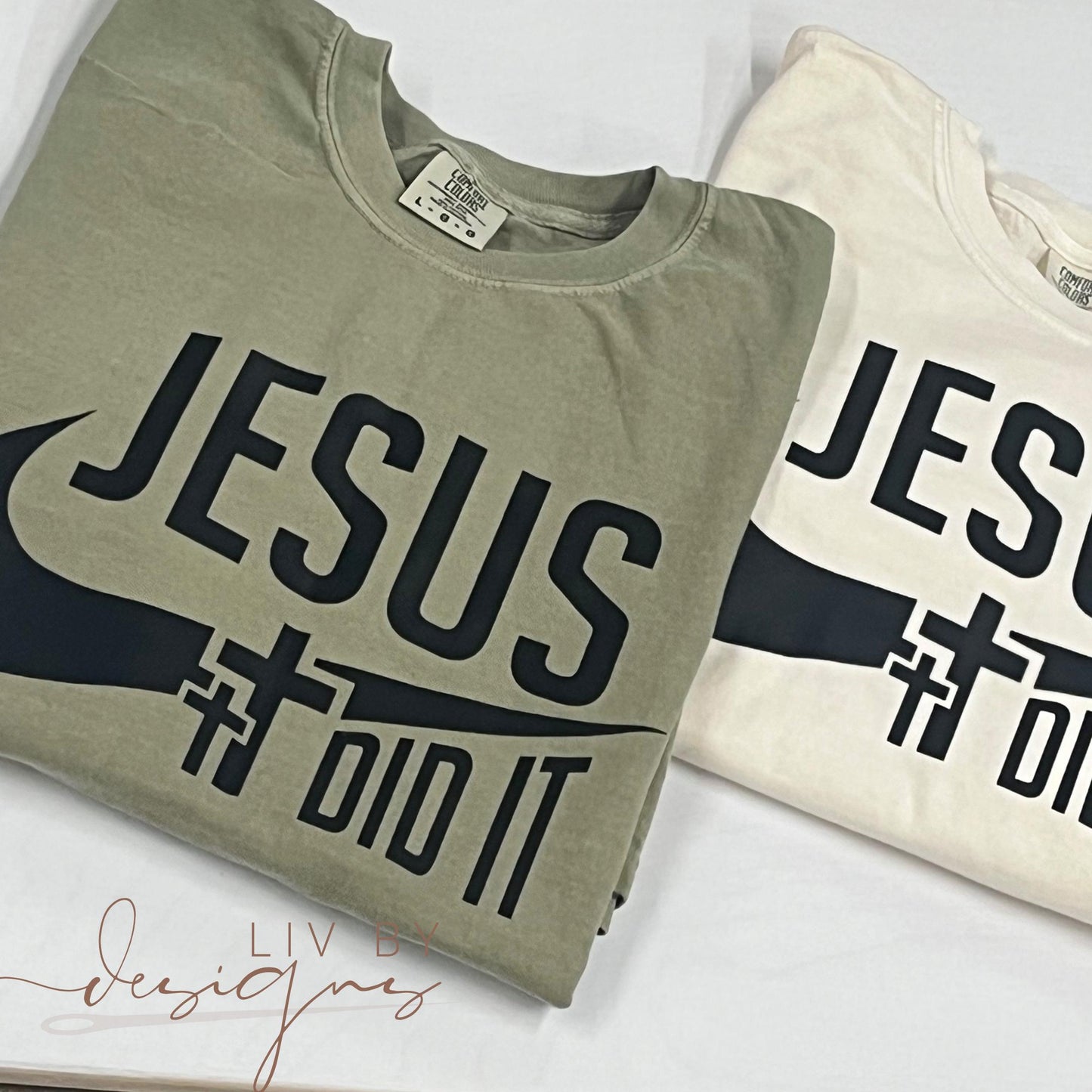Flat lay of Comfort Colors “Jesus Did It” T-shirt styled with jeans and cozy cardigan, faith-inspired clothing for men and women. (etsy image id: 6261138099)