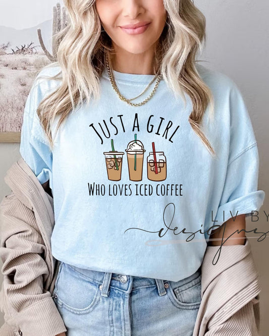 Woman wearing Comfort Colors “Just a Girl Who Loves Iced Coffee” light blue t-shirt with coffee cup design, styled with jeans and cardigan. (etsy image id: 6862722915)