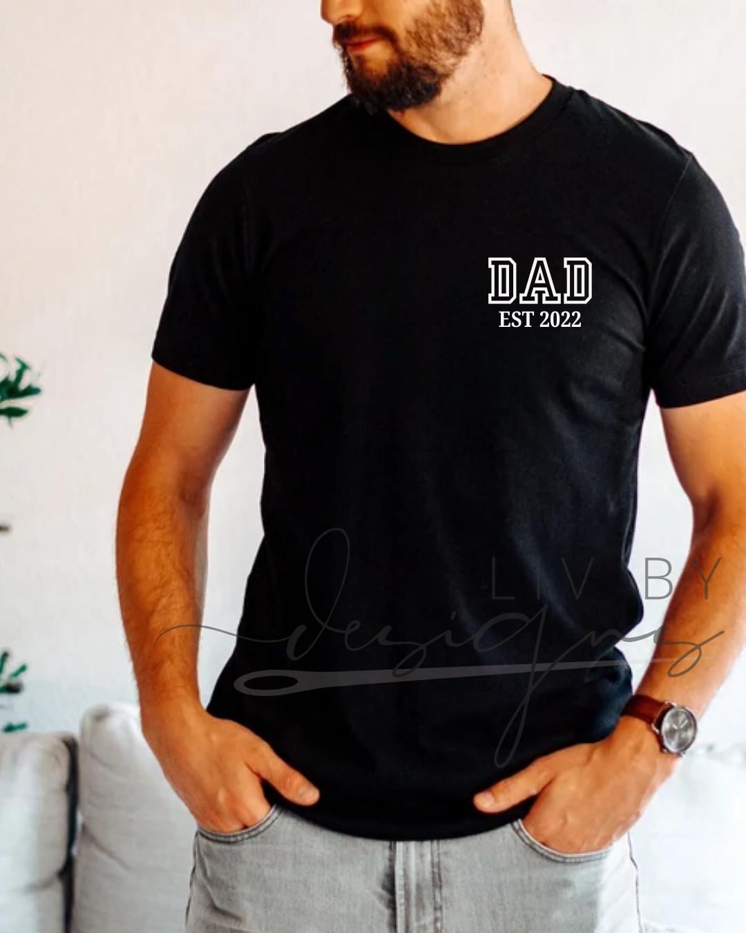 “Man wearing black DAD EST 2022 shirt in casual indoor setting” (etsy image id: 6936737513)
