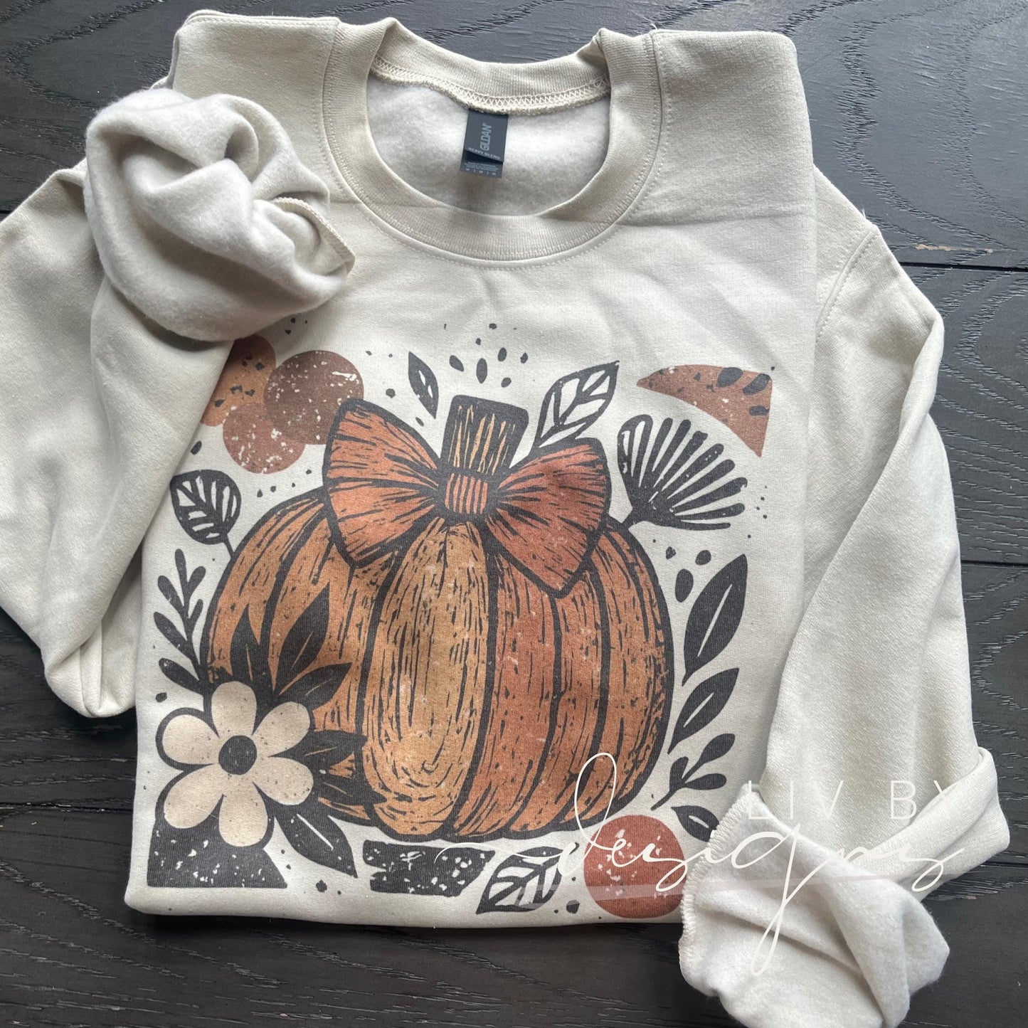 Sublimated Gildan crewneck with pumpkin bow design on sand color sweatshirt (etsy image id: 7029520334)