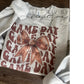 Cozy Gildan sweatshirt with Game Day text and football bow design (etsy image id: 7040283216)