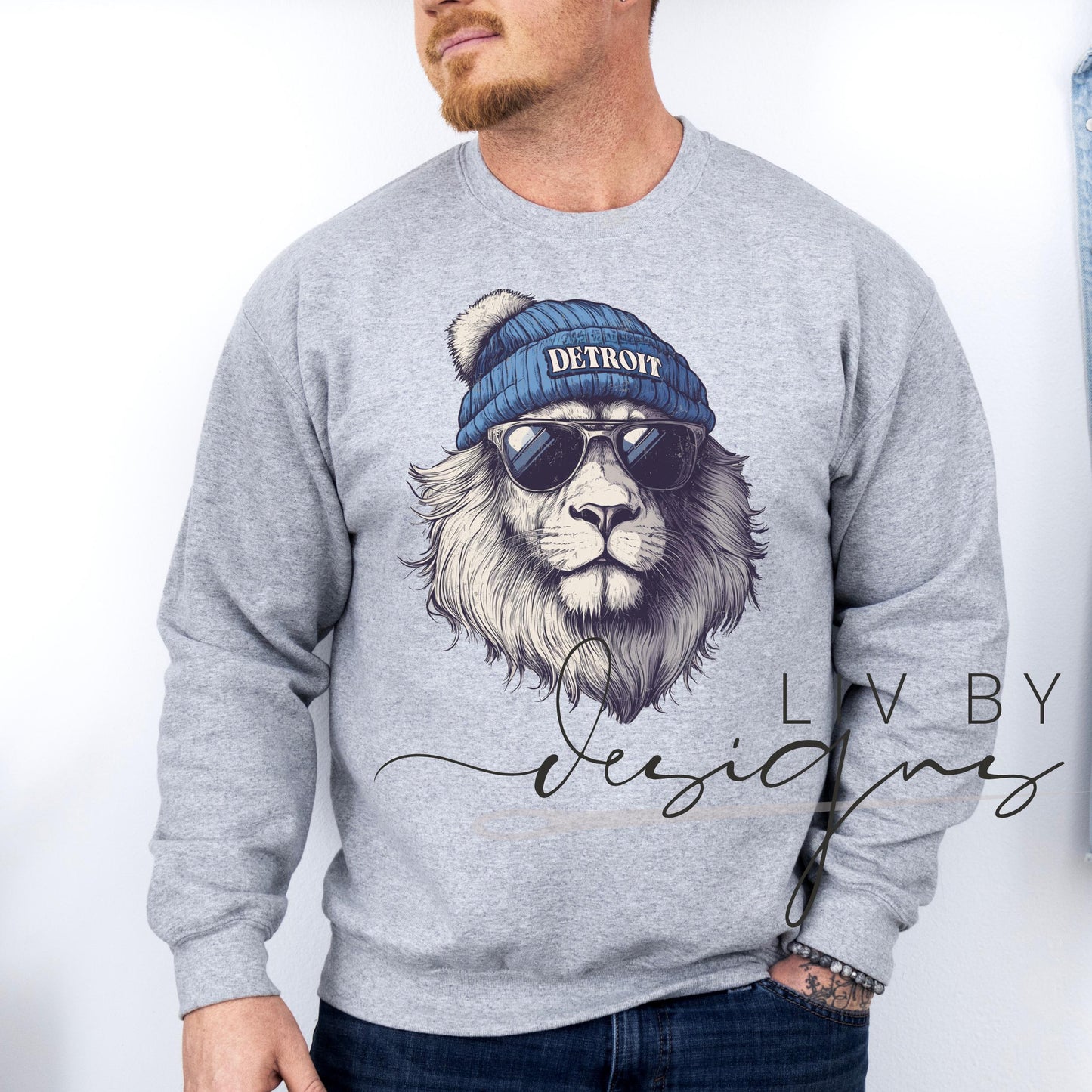 Close-up of DTF-printed Detroit lion spirit animal design on male model featuring a Gildan crewneck. (etsy image id: 7101160520)