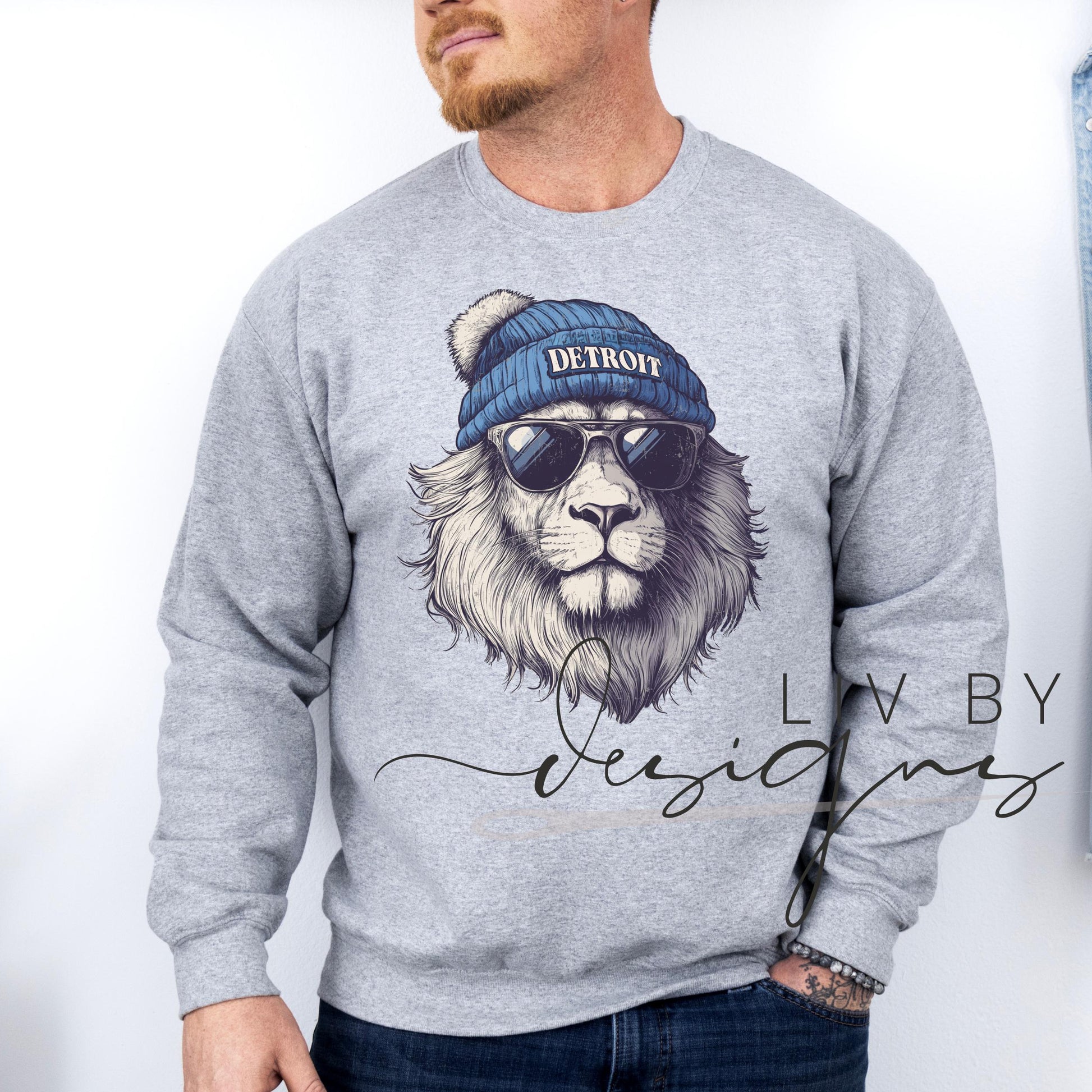 Close-up of DTF-printed Detroit lion spirit animal design on male model featuring a Gildan crewneck. (etsy image id: 7101160520)