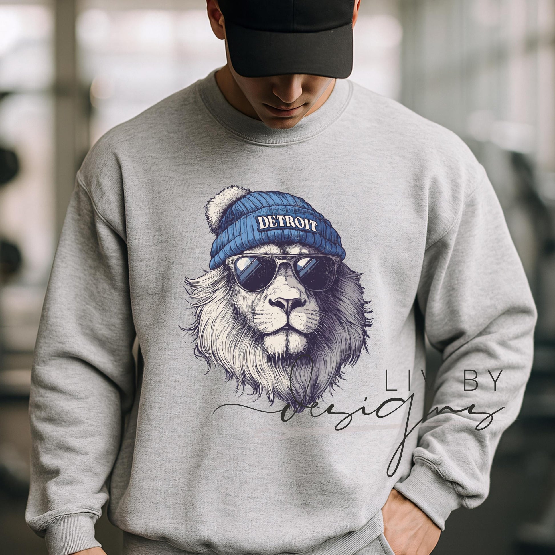 Close-up of DTF-printed Detroit lion spirit animal design on a male model featured on a Gildan crewneck. (etsy image id: 7149127731)