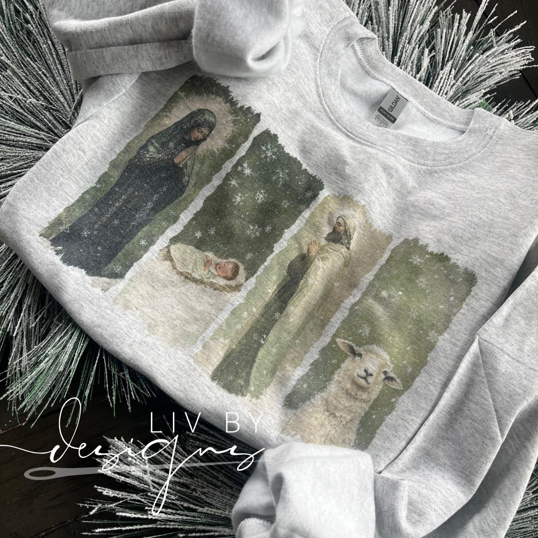 Nativity sublimated Gildan crewneck with Mary, Joseph, Baby Jesus, and lamb design in ash gray (etsy image id: 7413204067)
