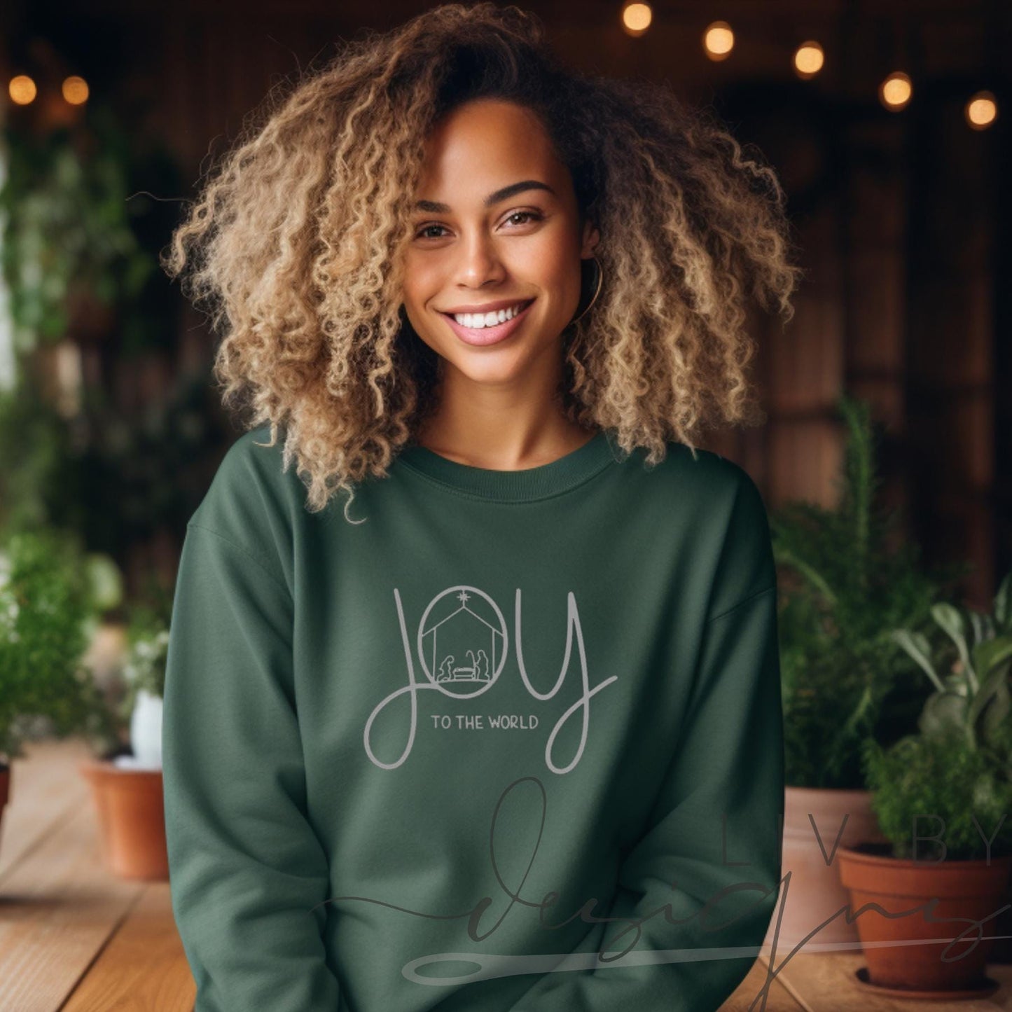 Woman wearing forest green Joy to the World nativity crewneck (etsy image id: 7431671486)