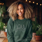 Woman wearing forest green Joy to the World nativity crewneck (etsy image id: 7431671486)