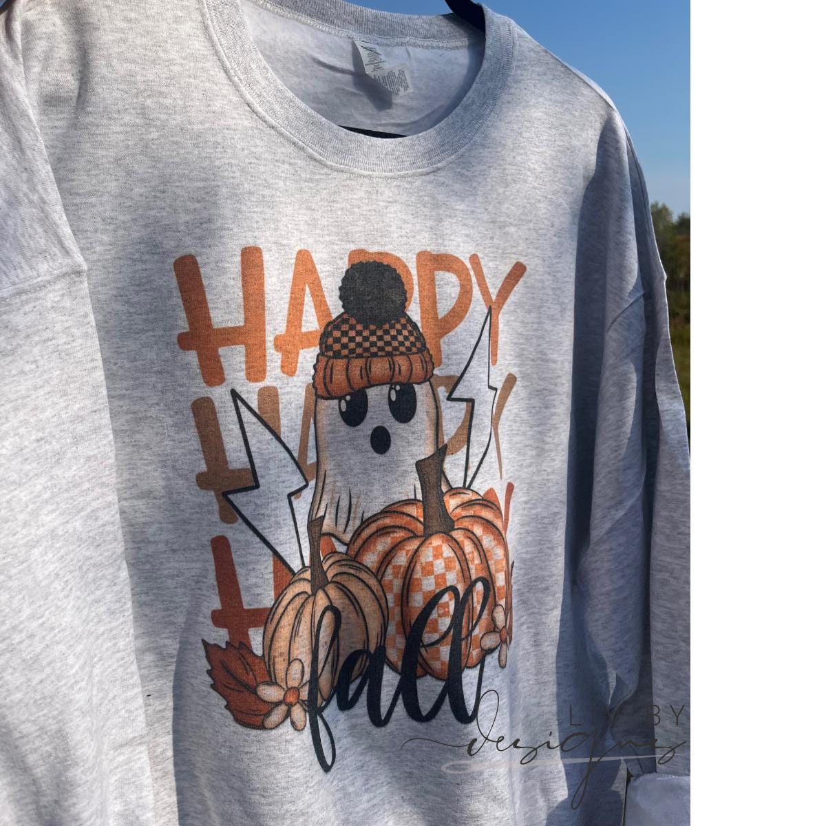 Cozy Halloween sweatshirt with autumn leaves and pumpkin graphic. (etsy image id: 7813066664)